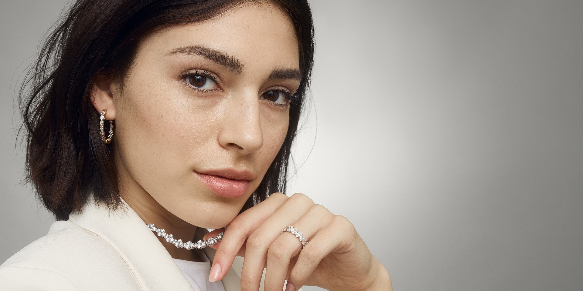 Woman wearing smart luxury jewelry from Blue Nile.
